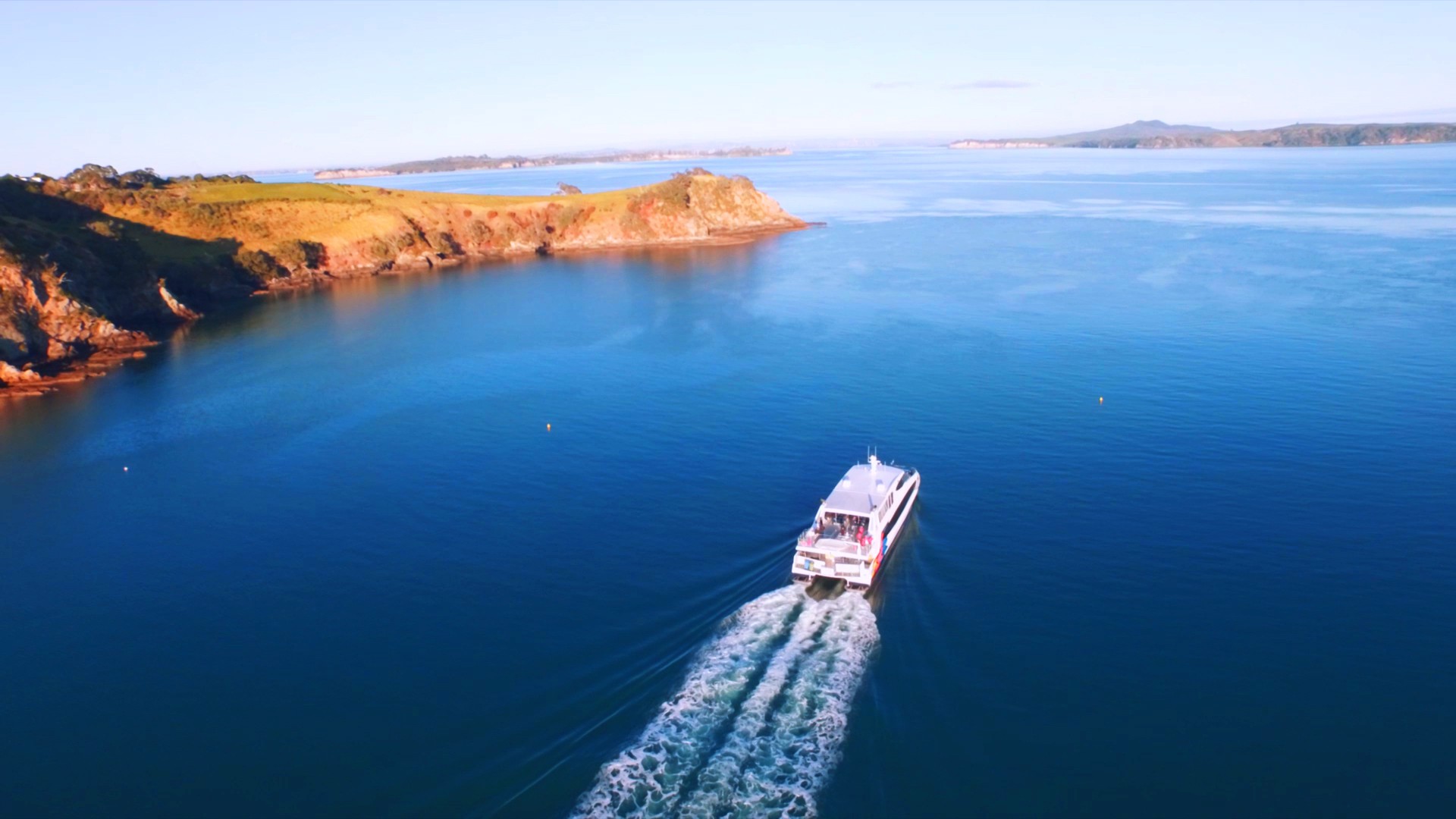 Fullers ferry boat cruising through Waiheke's Matiatia coast.
