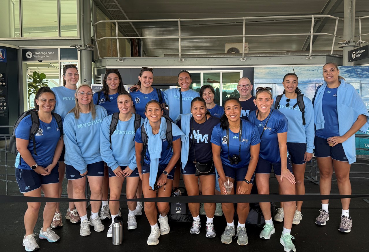 Northern Mystics team members group photo at the downtown Auckland ferry terminal